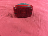 911 European rear bumper fog light chip on side of red lens 1984 -