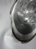 997 Headlight Left Driver has broken edge trim and back housing is cracked